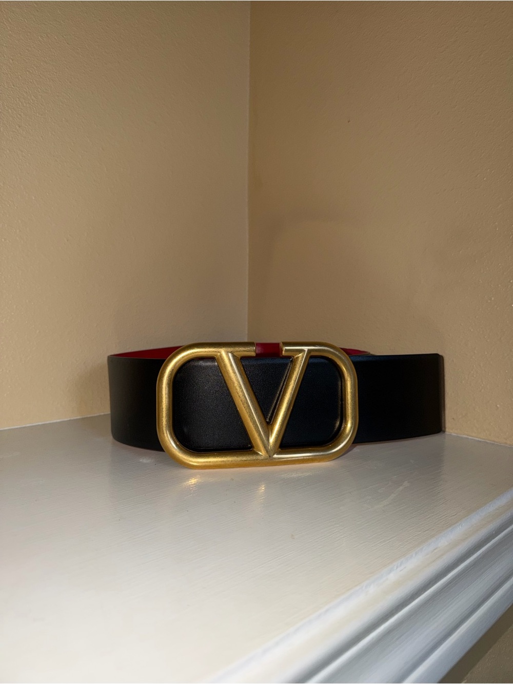 Valentino Garavani Black Leather Belt with Gold V Logo and Red Lining